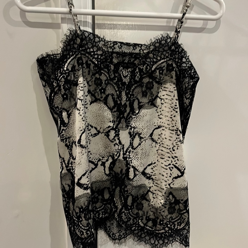 Robertson + Rodeo silk tank top with lace trim. Adjustable straps Size small